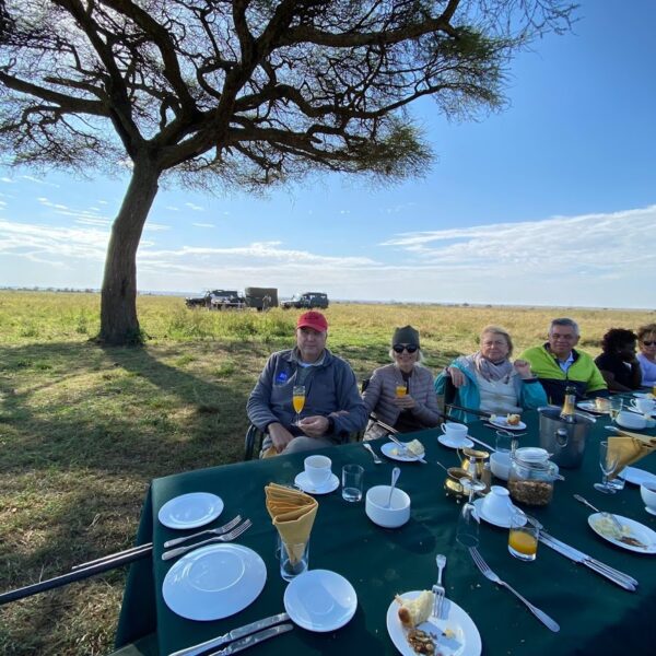 People are eating at the table.