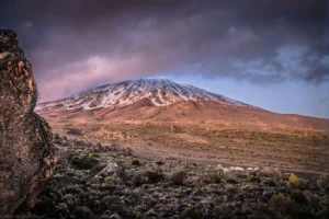 the summit of mountain Kilimanjaro covered with fogs and ice